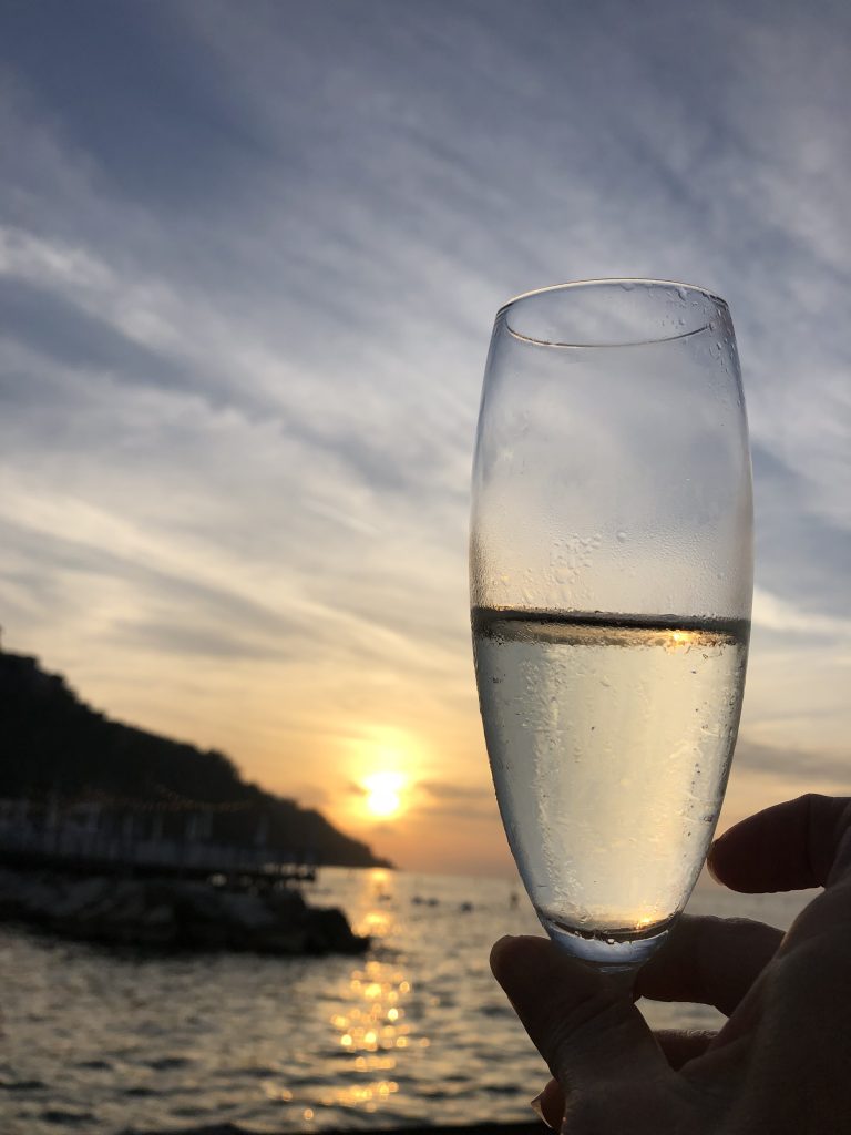 Toasting to a beautiful sunset in Sorrento
