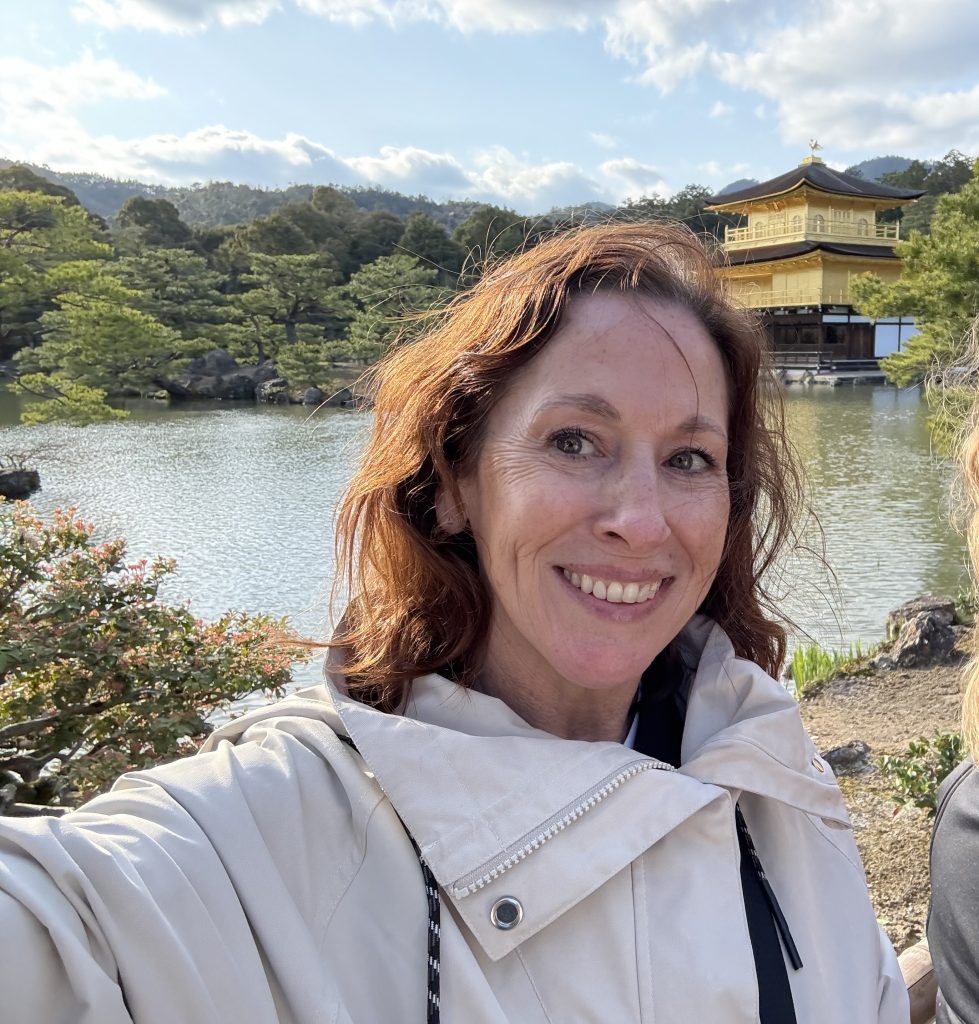 Standing in front of Kinkaku-ji, Kyoto's Golden Pavilion