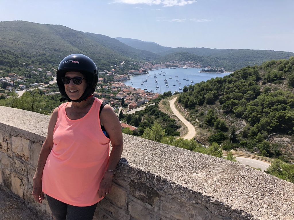 Mom and her helmet during a break from our moped tour on Vis